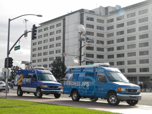 News vans park in front of Cal State Fullerton on December 13, 2012, the day after the lockdown.
